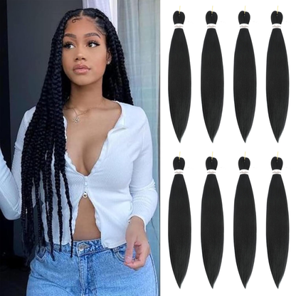 Woman with long braided hair next to bundles of black hair extensions.